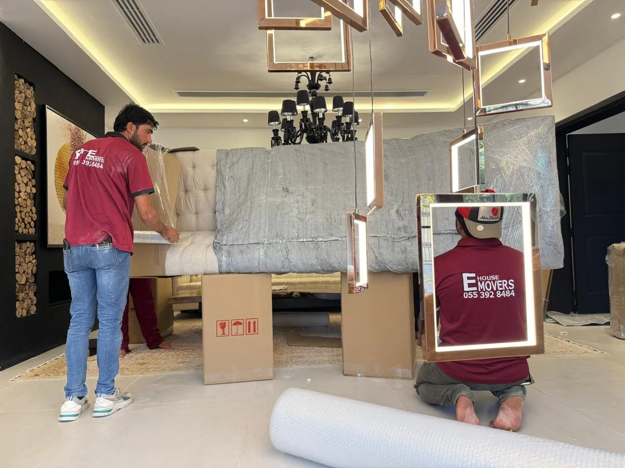 Furniture movers loading a shipment in Dubai