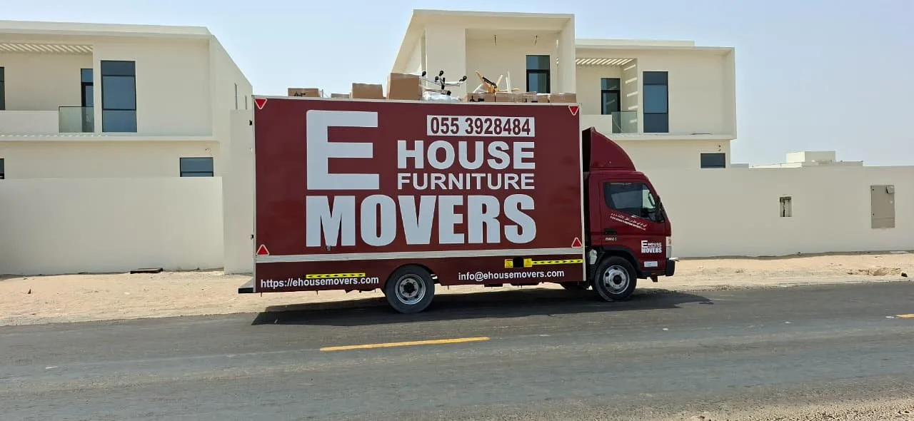 International moving truck loading an overseas shipment from Al Quoz